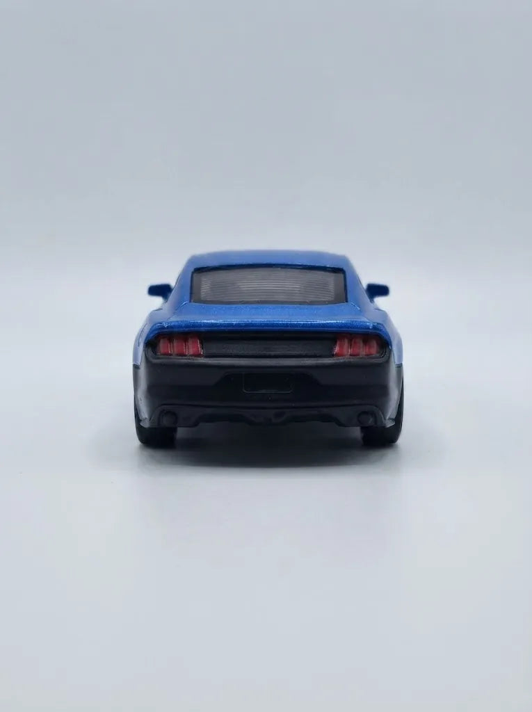 Blue die-cast pull-back car, rear view with dark bumper and taillights