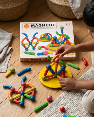 Magnetic construction set with colorful rods and ball connectors, assembled on base