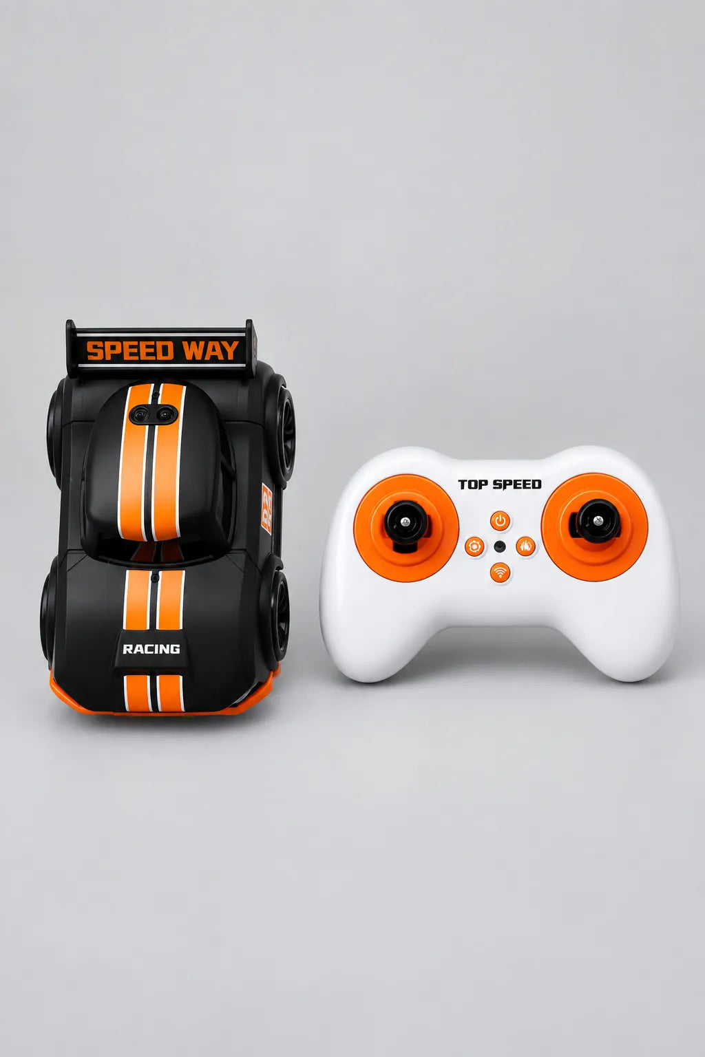 Black mini RC drift car with orange racing stripes, twin-stick controller and ages 3 plus packaging