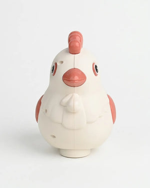 White and pink egg-laying rotating chicken toy with molded details