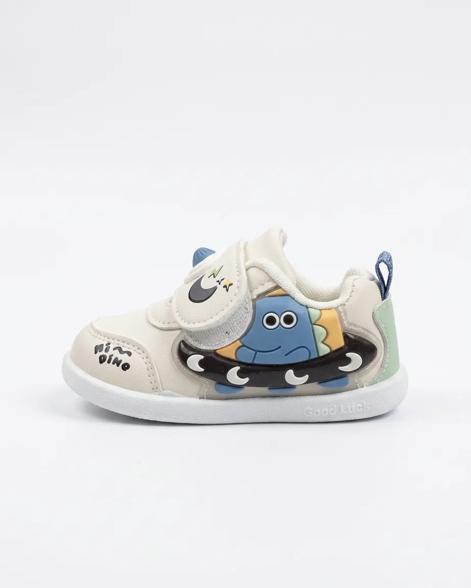 Kids low-top sneakers with cartoon creature patch, off-white uppers, blue trim