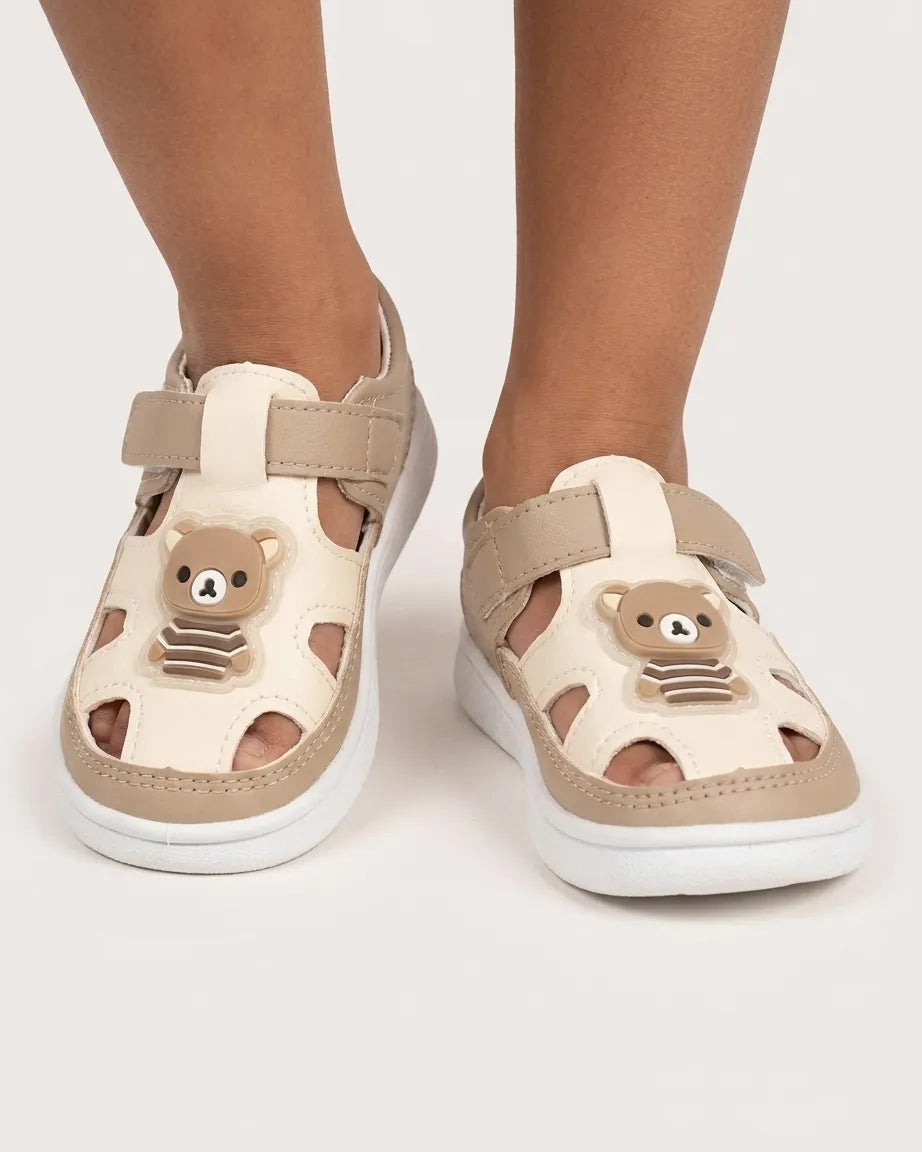 Toddler closed-toe fisherman sandals in beige with bear graphic and hook-and-loop strap
