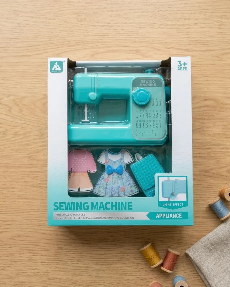 Boxed kids teal sewing machine pretend play set with fabric pieces and light effect
