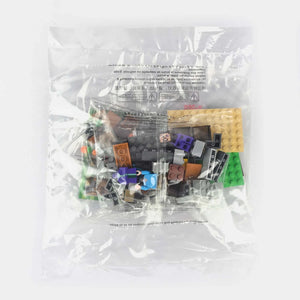 Building brick set pieces in clear plastic bag, mixed colored blocks and parts