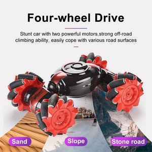Red and black four-wheel drive stunt RC car with oversized off-road tires