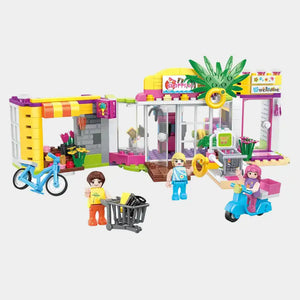 Shopping mall building blocks with yellow roof, pink counters, and mini figures