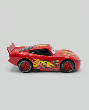 Red diecast pull-back car with #95 lightning and rear fin detail
