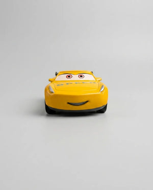 Disney Pixar Dinoco diecast pull-back car, yellow front with smile and Speed emblem