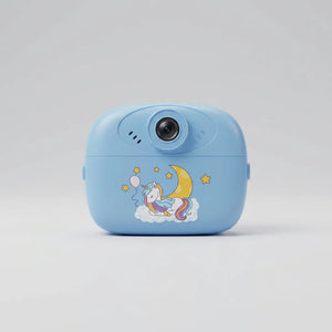 Pink instant print camera with paper rolls, wrist strap, USB cable and instruction booklet