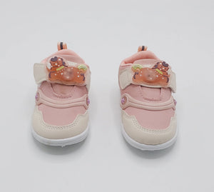 Front view of pink Glow Bear kids shoes with bear-detail straps