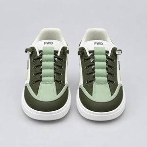 Front view of Pale Green DuoTrim kids sneakers showing green laces and contrast toe panels