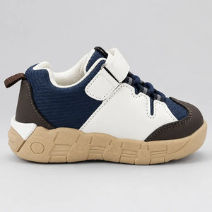 Front view of pair of navy and white kids sneakers with elastic-style laces