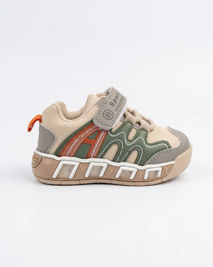 Beige and olive kids sneaker showing the chunky textured outsole