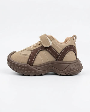 Child wearing Cruise beige and brown chunky sneakers with hook-and-loop straps