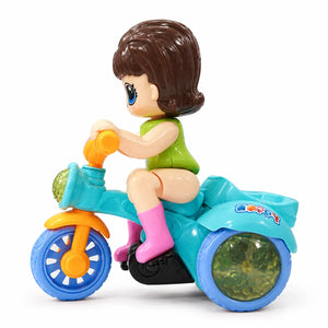 Front view of Stunt Tricycle Doll with green outfit, turquoise tricycle and blue wheels