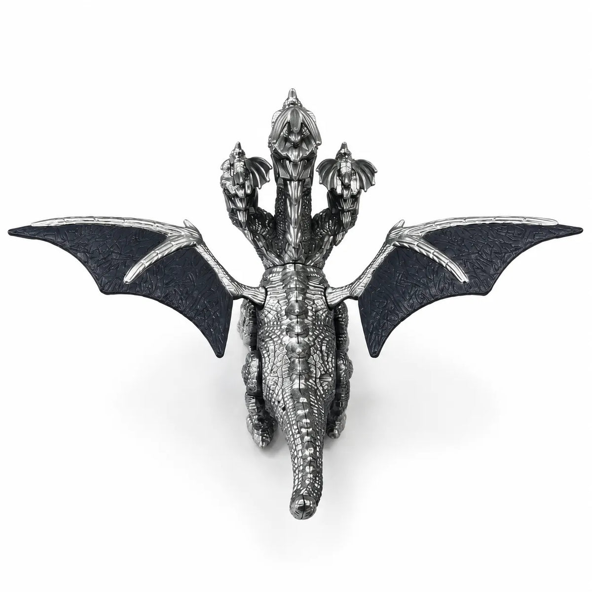 Rear view of the three-headed dragon toy showing wide wings, textured scales and long tail