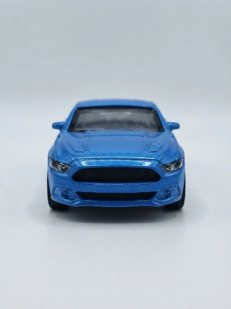 Blue die-cast pull-back car, front view with black grille and headlights