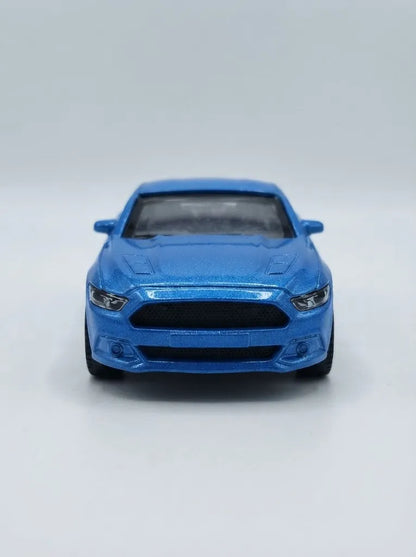 Blue die-cast pull-back car, front view with black grille and headlights