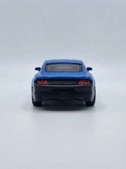 Blue die-cast pull-back car, rear view with dark bumper and taillights