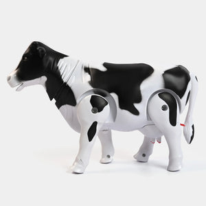 Black-and-white walking cow toy, side view with round eye panels
