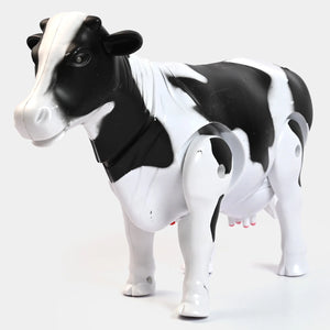 Black-and-white cow toy, front angled view with molded head and legs