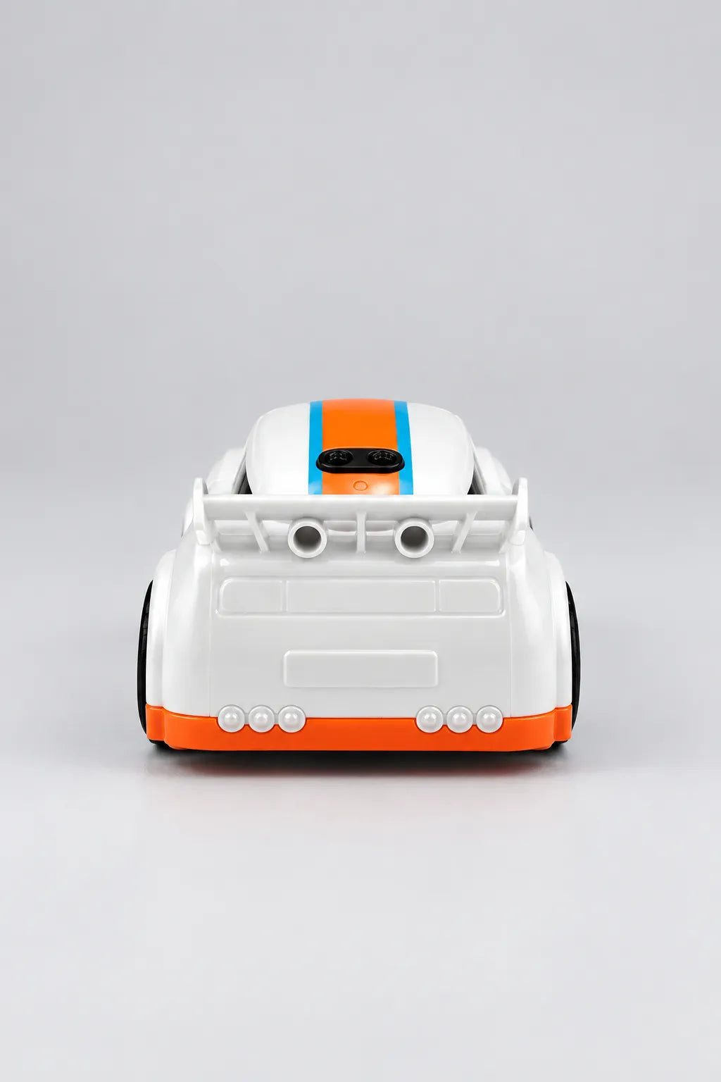 Front view of white mini RC drift car with orange grille and orange and blue racing stripes