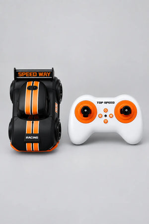 Black mini RC drift car with orange racing stripes, twin-stick controller and ages 3 plus packaging