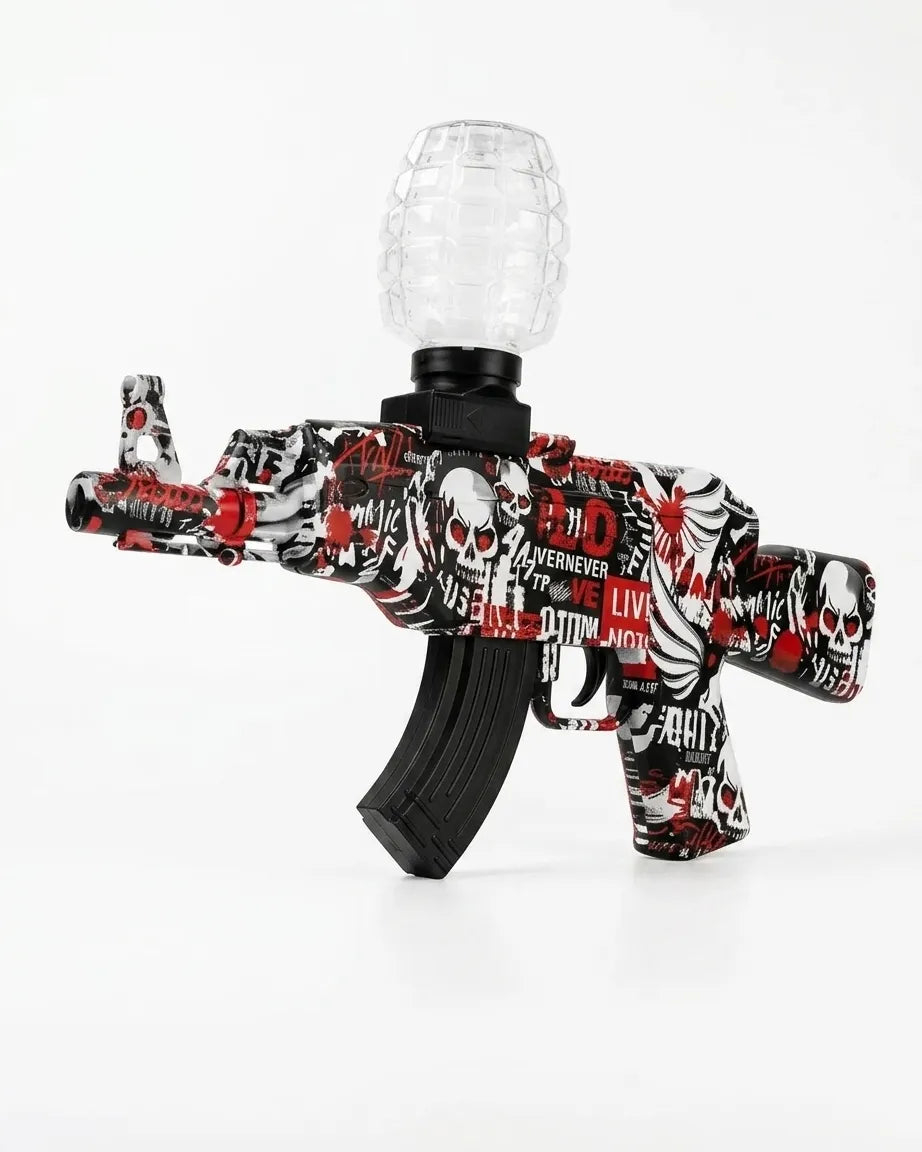 Gel blaster toy gun with red/black/white skull graffiti and clear hopper