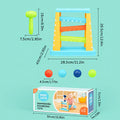 Baby hammering pounding toy with mallet and colorful balls on blue base frame.
