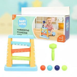 Hammering pounding toy with mallet and four balls shown with packaging.
