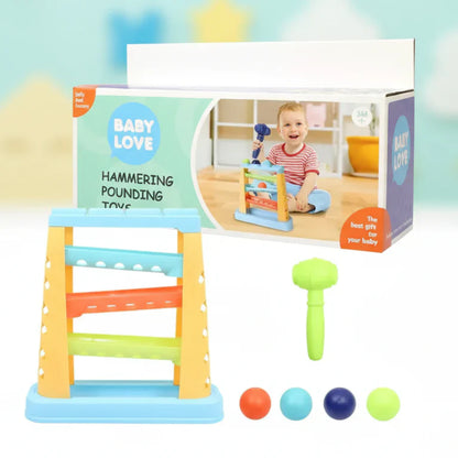 Hammering pounding toy with mallet and four balls shown with packaging.