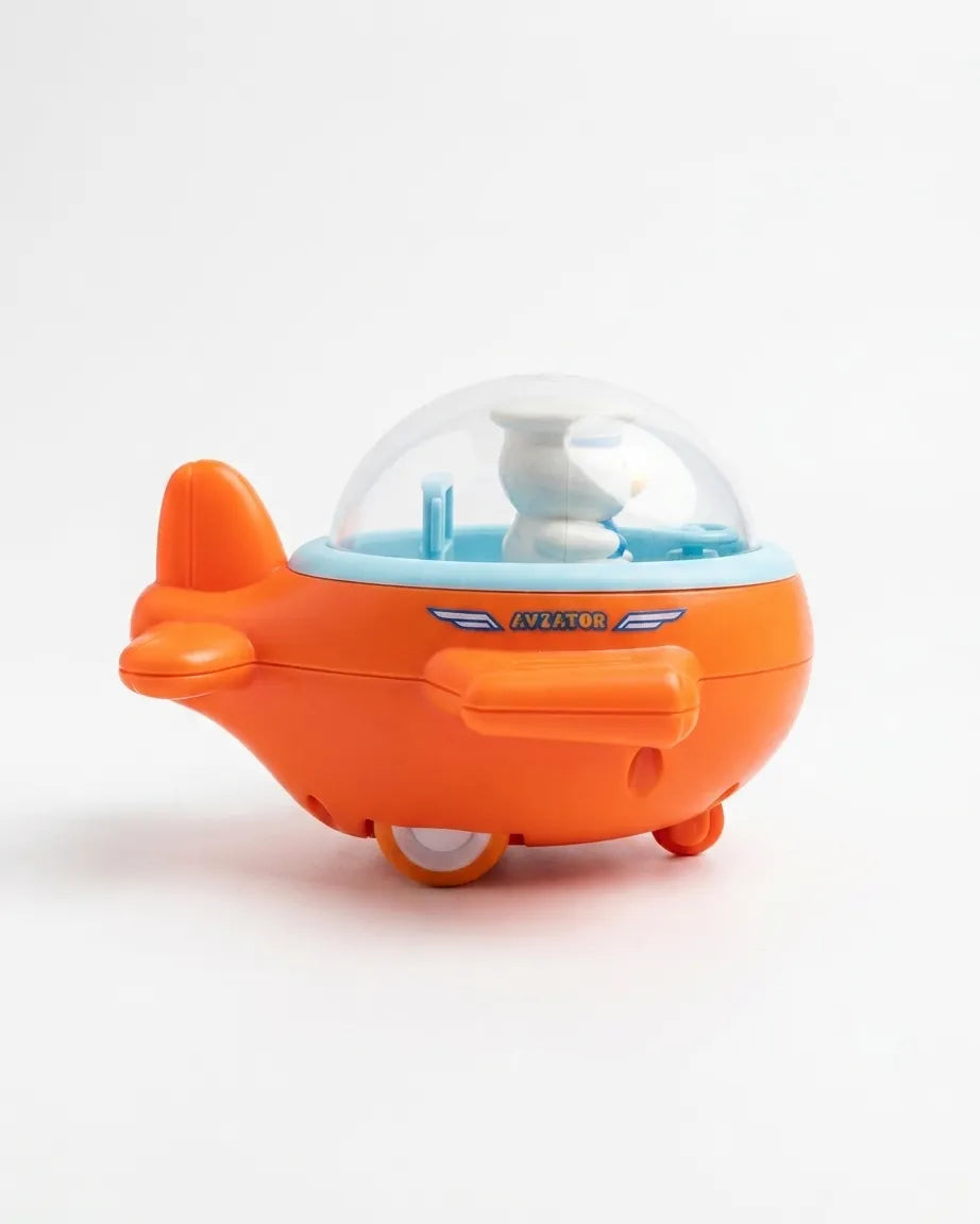 Orange mini airplane toy with clear dome cockpit, snowman pilot, landing wheels visible.