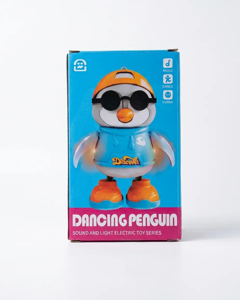 Dancing penguin toy in retail box with blue outfit, orange shoes, and round goggles
