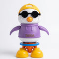 Dancing penguin toy figure with yellow cap, black goggles, purple shirt, orange beak and boots