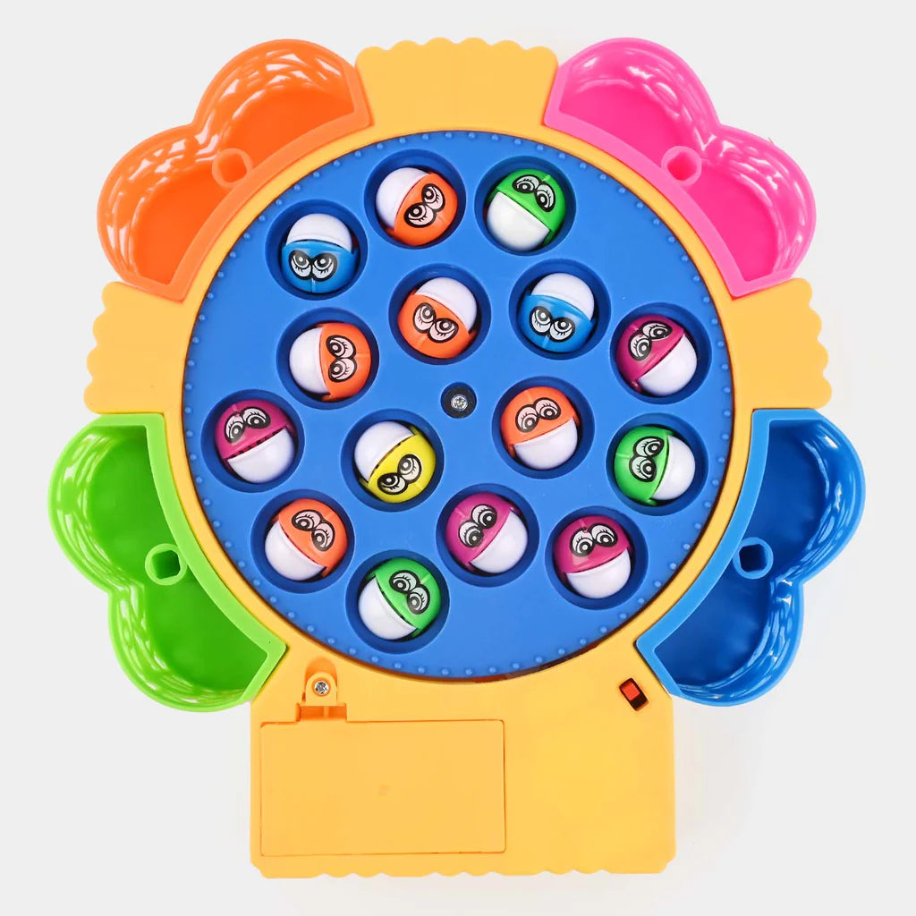 Close-up of colorful electric fishing game board with fish buttons and turn handles