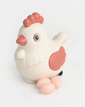 White and pink rotating chicken toy with egg-laying design and egg