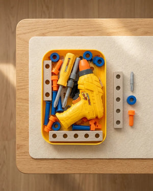 Yellow drill toy set with screws, bits, and wrenches in a plastic tray