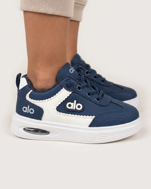 Grey Alo kids sneaker side profile with black contrast panel and white chunky sole