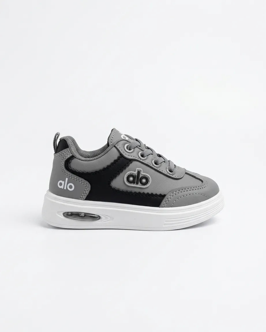 Pair of blue Alo kids sneakers from the front with navy laces and white soles