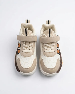 Rear view of beige kids sneaker showing heel pull tab and chunky sole