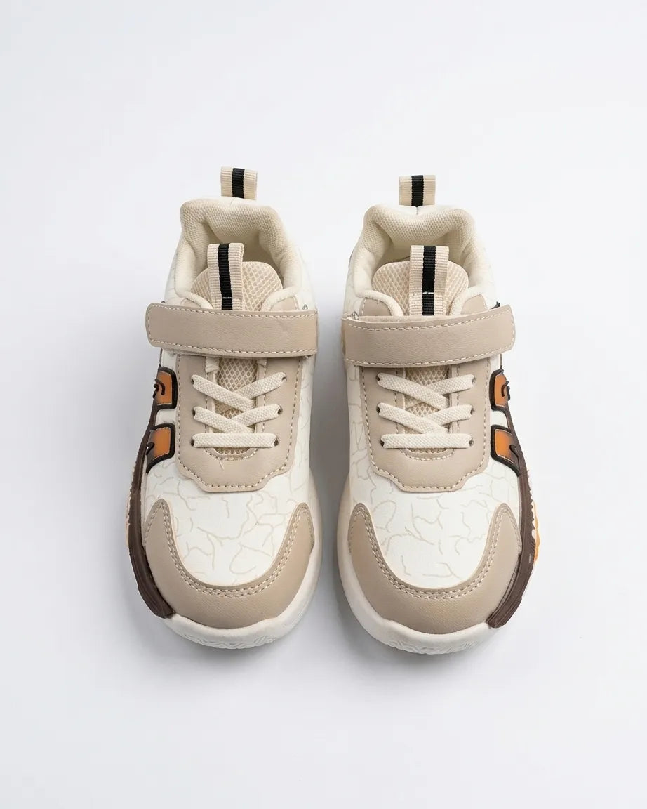 Rear view of beige kids sneaker showing heel pull tab and chunky sole