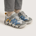 Kids sport sneaker in grey, blue and yellow with Velcro strap, side view