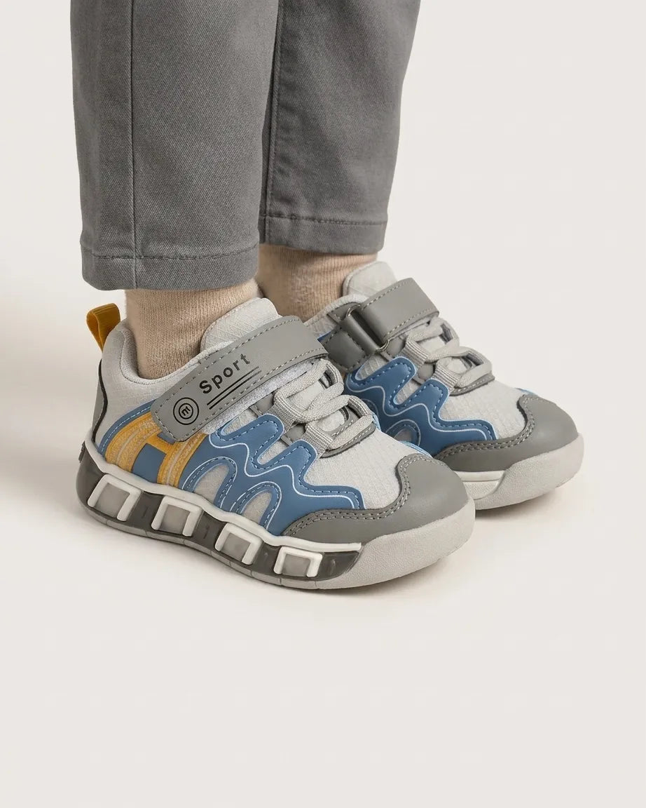 Kids sport sneaker in grey, blue and yellow with Velcro strap, side view