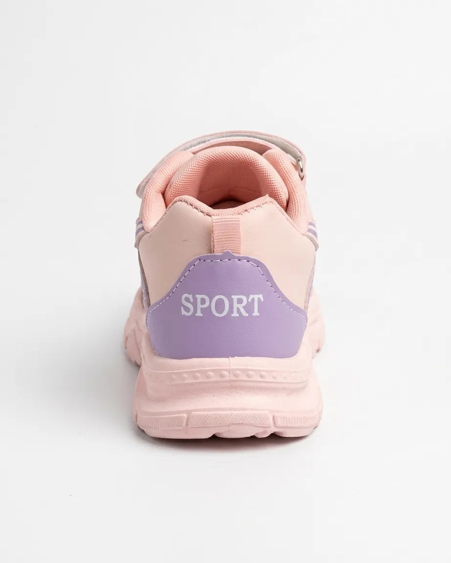 Pink kids chunky sneakers with straps worn on feet