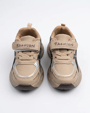 Beige kids chunky sneakers with straps worn on feet