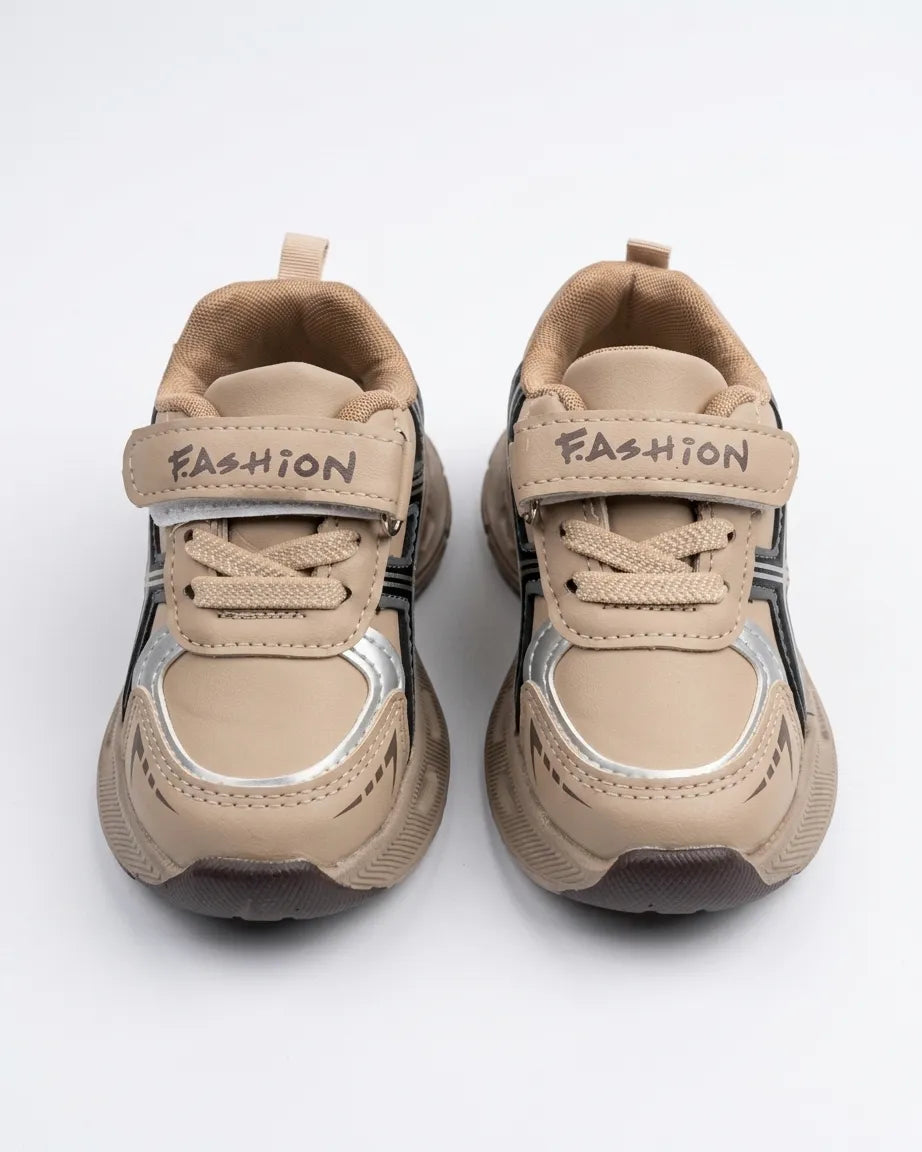 Beige kids chunky sneakers with straps worn on feet
