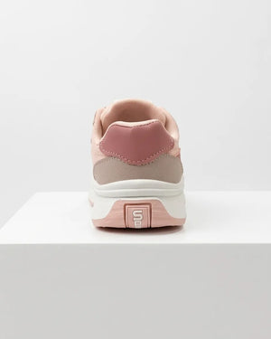 Front view of pink girls' sneakers with laces and hook-and-loop straps