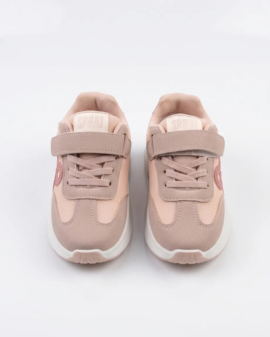 Side view of pink girls' sneaker with tonal side detail and white sole