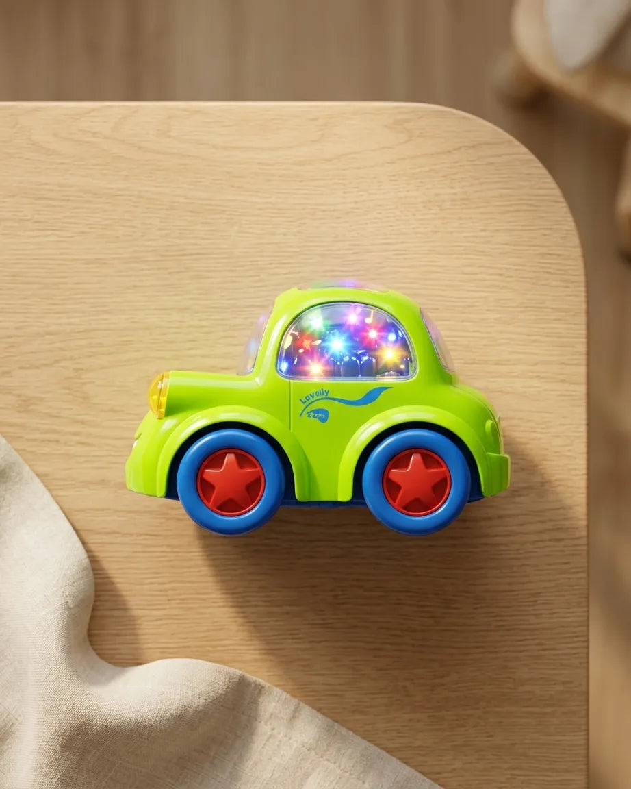 Green light-up musical toy car on a wooden surface, front and side view