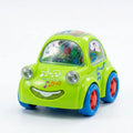 Green light-up musical toy car with blue wheels and smiling grille, front view